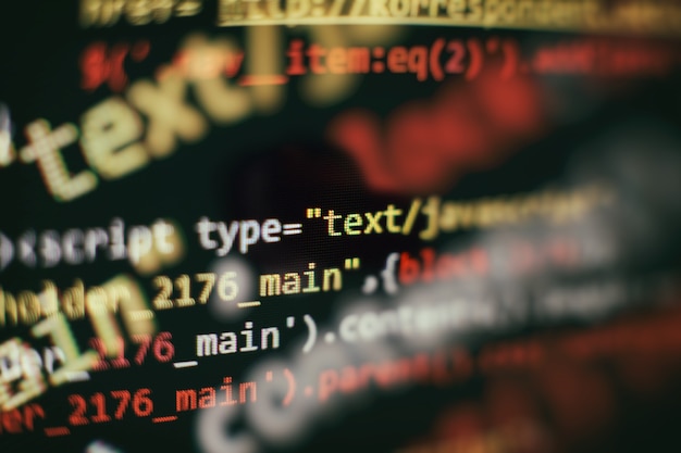 Software developer programming code. Abstract computer script code. Selective focus