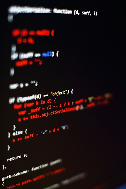 Software developer programming code. Abstract computer script code. Selective focus