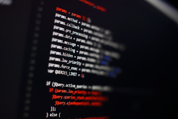 Software developer programming code. Abstract computer script code. Selective focus