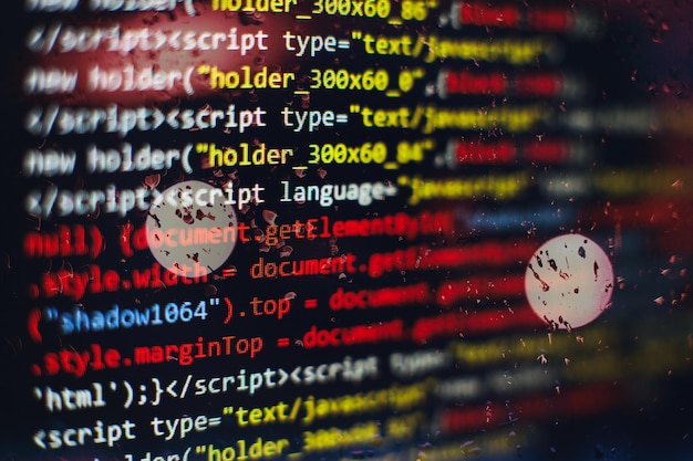 Photo software developer programming code. abstract computer script code. selective focus
