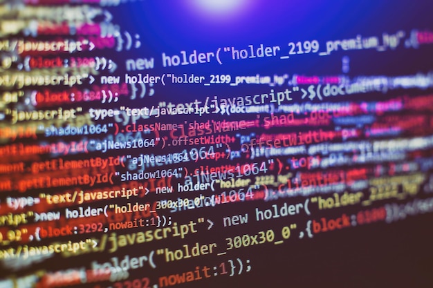 Software developer programming code. Abstract computer script code. Selective focus