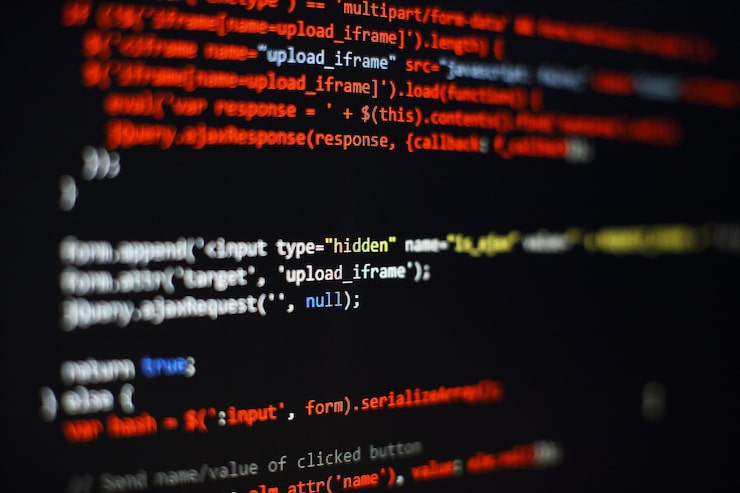 Photo software developer programming code. abstract computer script code. selective focus