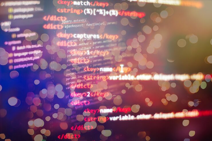 Photo software developer programming code. abstract computer script code.