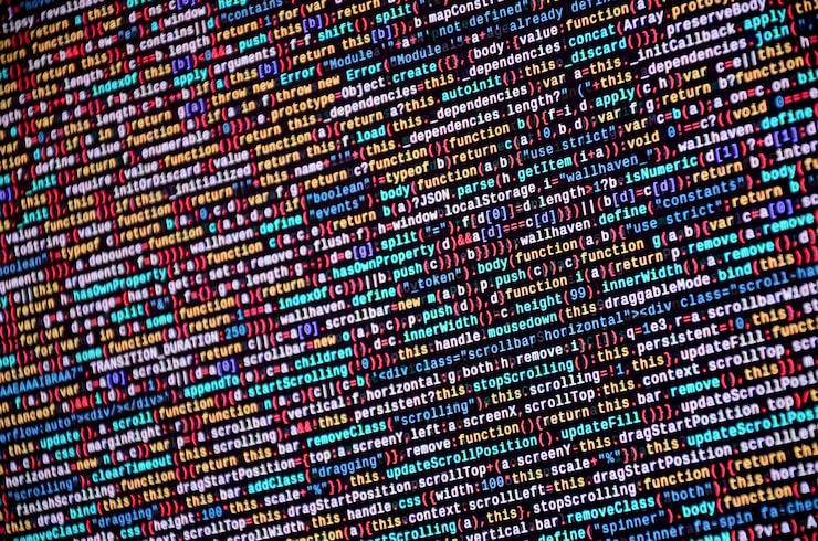 Photo software developer programming code on computer. abstract computer script source code