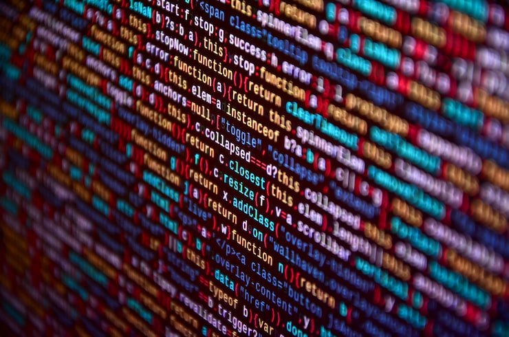 Photo software developer programming code on computer. abstract computer script source code