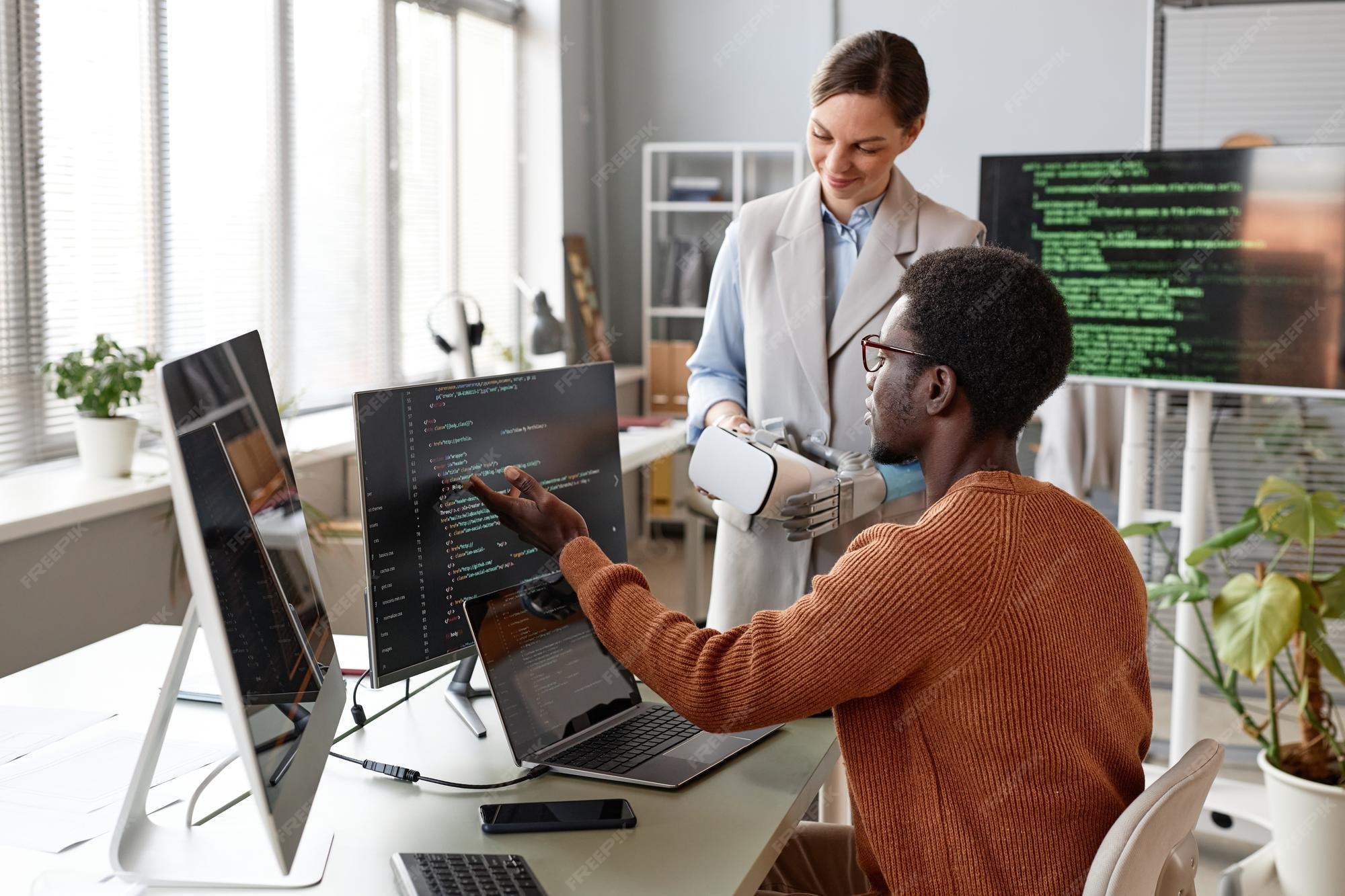 Premium Photo | Software developers discussing programming code when ...