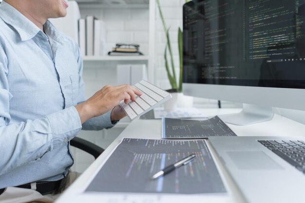 Premium Photo | Software development concept male programmer using ...