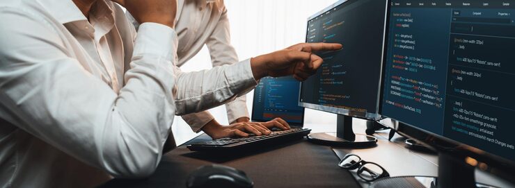 Photo software development team working together in office coding script display on computer monitor programmer and software engineer working in tech developer company trailblazing