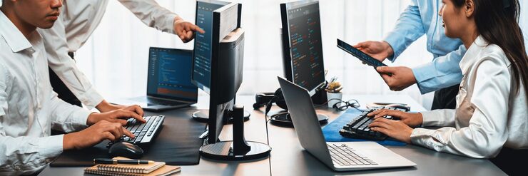 Photo software development team working together in office coding script display on computer monitor programmer and software engineer working in tech developer company trailblazing
