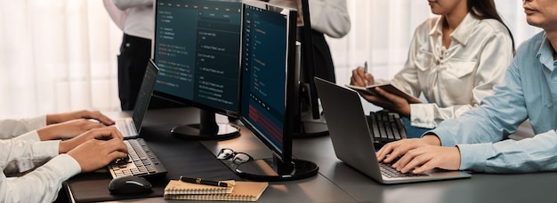 Software development team working together in office coding script display on computer monitor Programmer and software engineer working in tech developer company Trailblazing