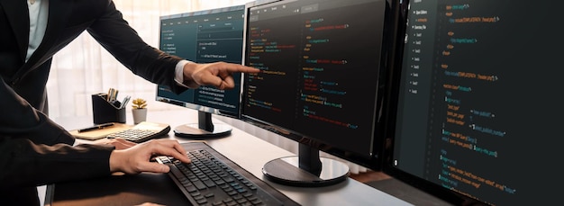 Software development team working together in office coding script display on computer monitor Programmer and software engineer working in tech developer company Trailblazing