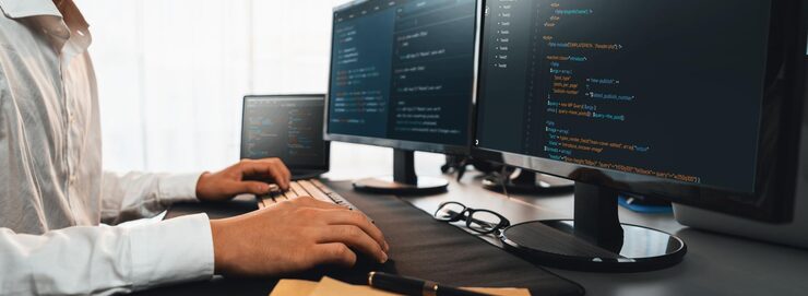Photo software engineer working on application development on his computer display code and script on monitor at tech company office workplace application developer solving and writing code trailblazing