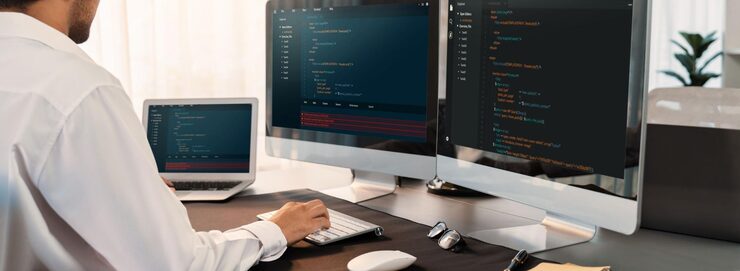 Photo software engineer working on application development on his computer display code and script on monitor at tech company office workplace application developer solving and writing code trailblazing