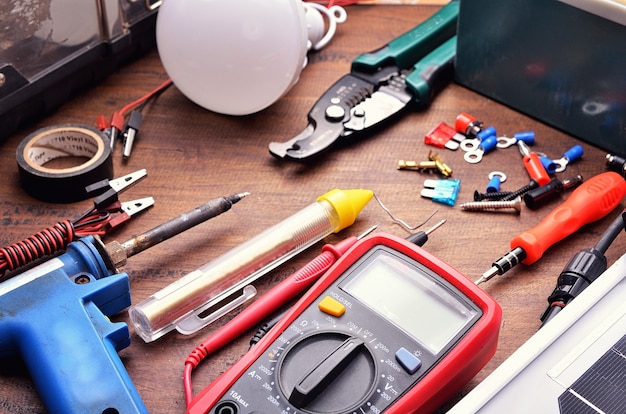 Solar cell panel and tools equipment for green building and energy saving concept. on wooden background. Top view