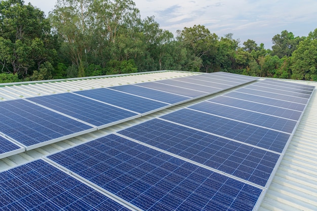 Photo solar cells panel installed on the roof of a large building are full of dirt and dust.