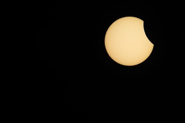 Solar eclipse with black sky