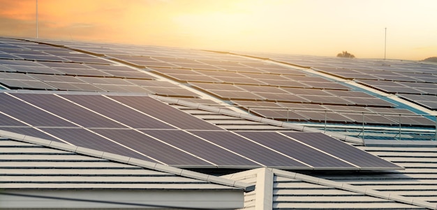 Solar energy for factory or warehouse building Solar panels on the roof of industrial plant