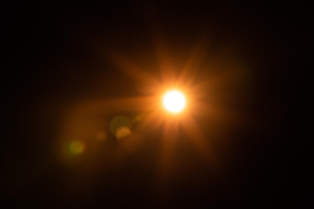 Solar lens flare on black background