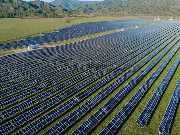 Solar panels built into many nearby stand on the territory of mountain ranges from a bird's-eye view.