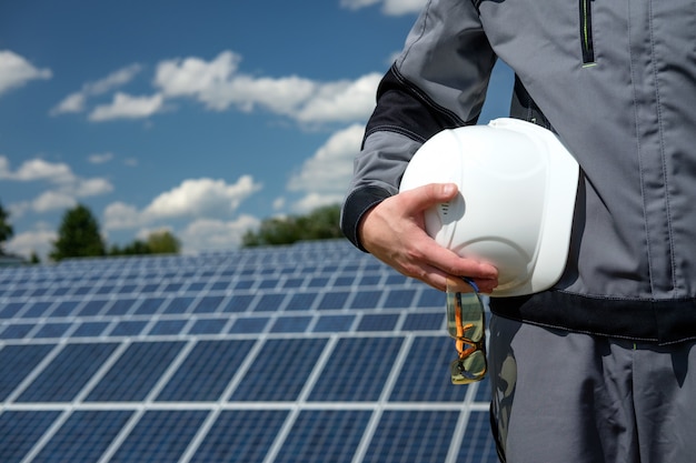 Solar panels engineer in white cask