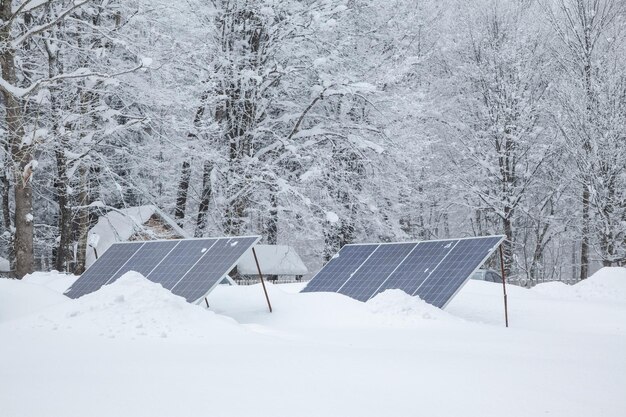 Solar panels on the glamping in the winter forest