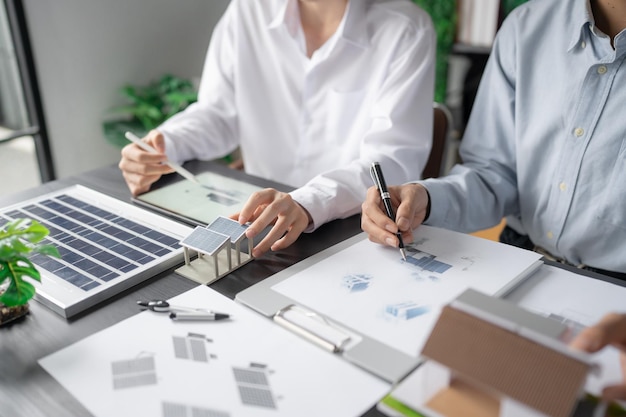 Solar panels green energy Business man working green eco friendly office business creative idea Planing Bio economy for business eco friendly professional Engineer sustainable electricity