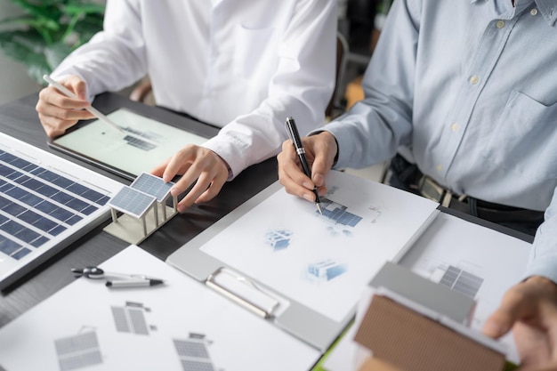 Solar panels green energy Business man working green eco friendly office business creative idea Planing Bio economy for business eco friendly professional Engineer sustainable electricity