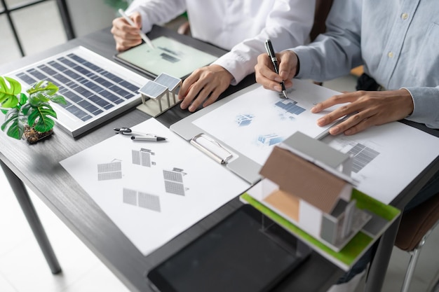 Solar panels green energy Business man working green eco friendly office business creative idea Planing Bio economy for business eco friendly professional Engineer sustainable electricity