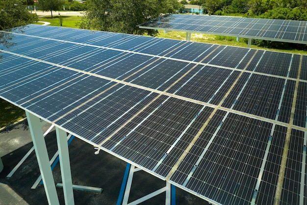 Solar panels installed over parking lot for parked cars for effective generation of clean energy