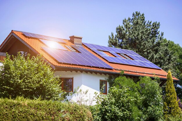 Solar Panels on Roof of Private House Eco House in Green City