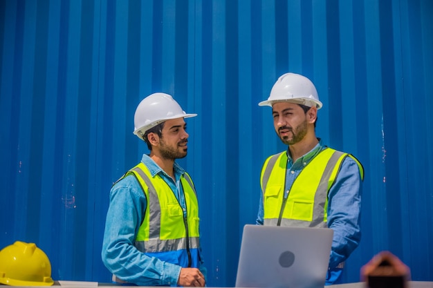 Solar power plant engineers meeting and examining photovoltaic panels Concept of alternative energy and its service Engineer energy power man worker at site