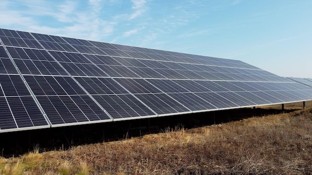 Solar power plant Flight over the modules of solar power station on sunny day