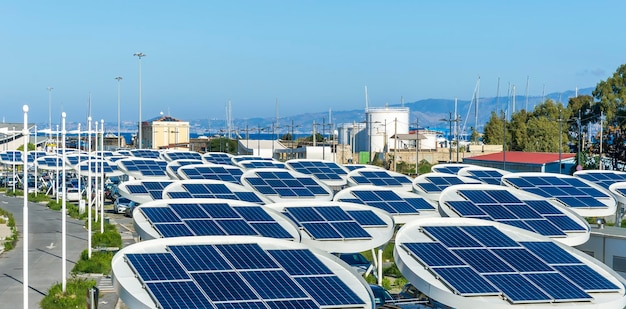 Photo solar power plant with big antennas on a parking for charging electrocars car energy of future