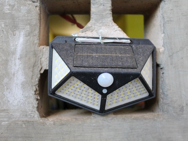 Solar powered emergency lights hanging on the wall