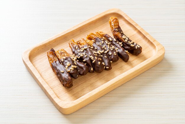 Solar sun dried banana chocolate coating or banana dipped chocolate