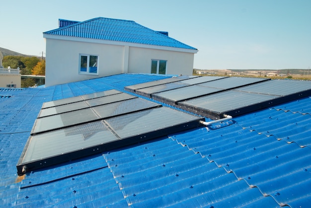 Solar water heating system on the house roof.