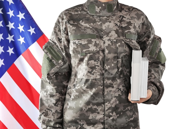 Soldier holding books Military education concept