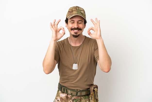 Soldier man isolated on white background in zen pose