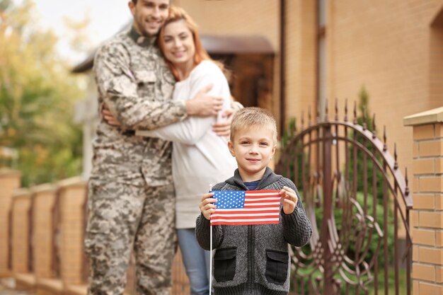 Soldier reunited with his family on a sunny day