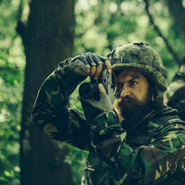 Soldier with camera in forest