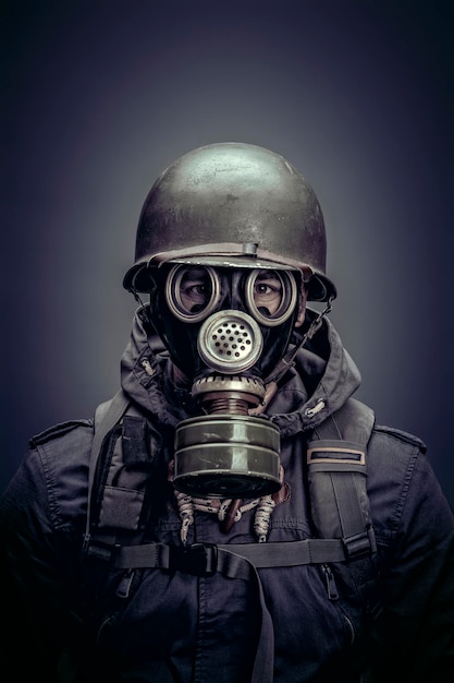 Soldier with helmet and gas mask