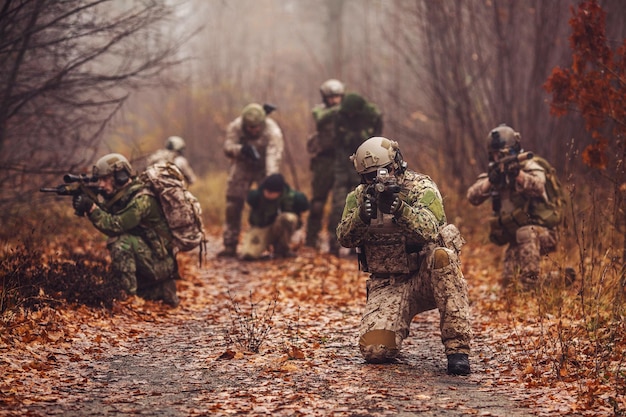 Soldier with rifle Military man on the background of nature