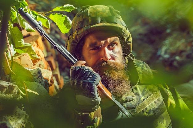 Soldier with sad face in military helmet and camouflage