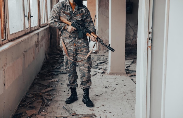 Soldiers in camouflage with a military weapon