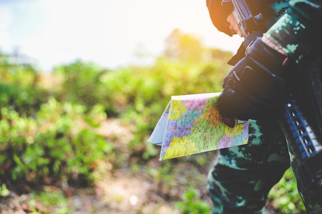 Soldiers in the forest stand defending the territory