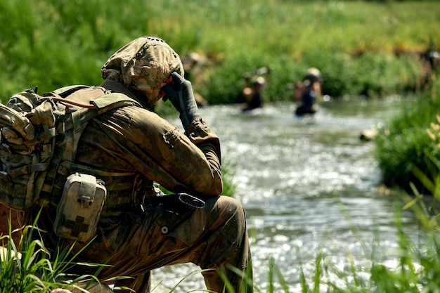 Soldiers game on military training ground battle camp action\
operation trainer giving training to military soldiers at boot\
camp