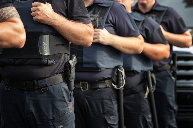 Photo soldiers security in the ranks ammunition equipment and weapons with a shallow depth of field