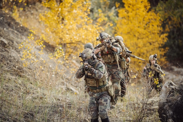 Soldiers team is fighting on the territory occupied by the enemy