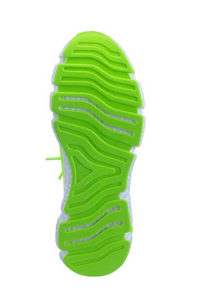 Sole of green sneaker on white background