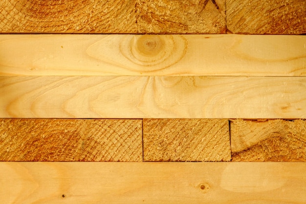 Solid background of new wooden bars Yellow wood